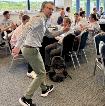 Photo of Tom Manners, keynote speake, presenting to delegates of GLOW Maths Hub's Secondary MathsFest conference